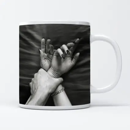 Black and White Hands Grasping Bed Sheet