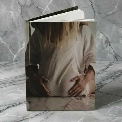 Pregnant Woman Couple Embrace Marble Table