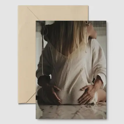 Pregnant Woman Couple Embrace Marble Table
