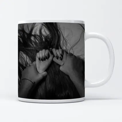 Black and White Hands Grasping Dark Hair