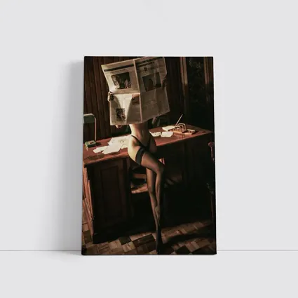 Sexy Woman Reading Newspaper at Office Desk