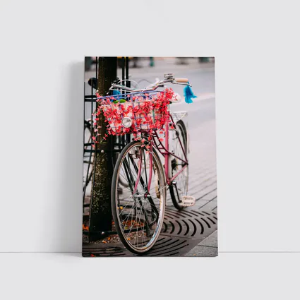 Pink Bicycle With Flowers On City Street