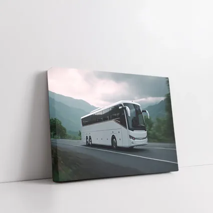 White Coach Bus Driving Through Mountain Road