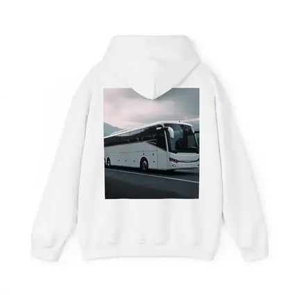 White Coach Bus Driving Through Mountain Road