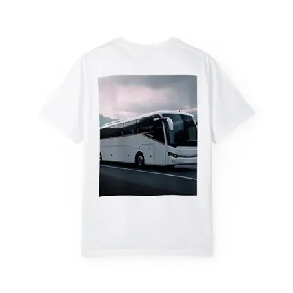 White Coach Bus Driving Through Mountain Road