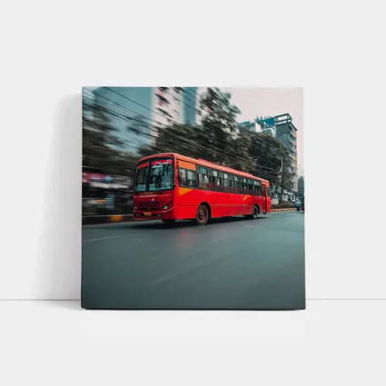Red Bus Speeding Through Urban City Street