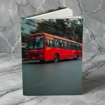 Red Bus Speeding Through Urban City Street