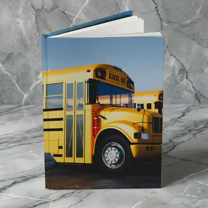 Yellow School Buses Lined Up Blue Sky