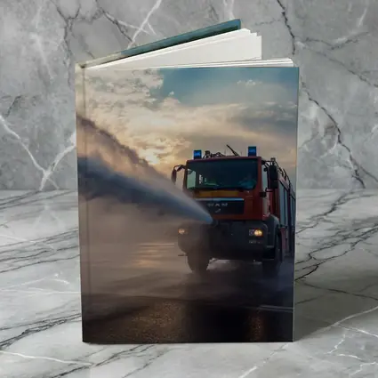 MAN Fire Truck Spraying Water Dramatic Sky