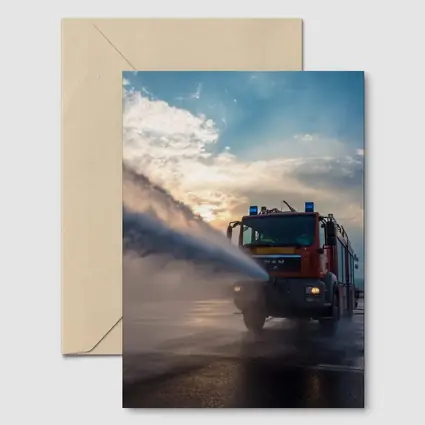 MAN Fire Truck Spraying Water Dramatic Sky