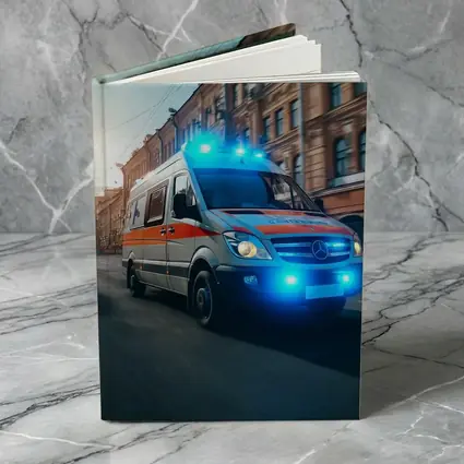 Mercedes Ambulance Racing Through City Street