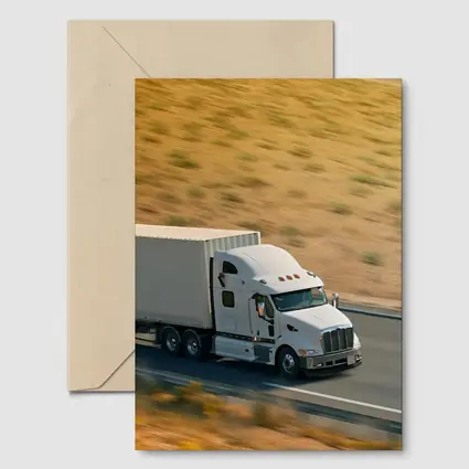 White Semi Truck Speeding Down Desert Highway