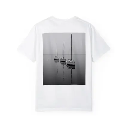 Three Sailboats Reflecting on Foggy Water