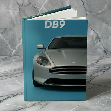 Aston Martin DB9 Silver Blue Background