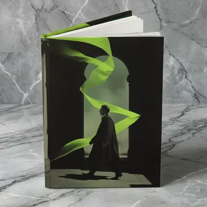 Man in Coat Neon Green Ribbon Archway