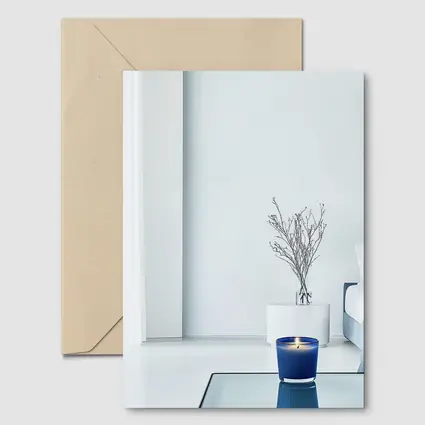 Blue Candle Glowing in Minimalist White Room