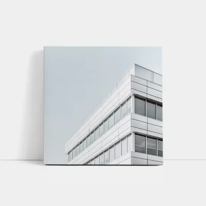 White Modern Building Corner Against Gray Sky