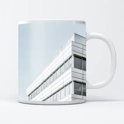 White Modern Building Corner Against Gray Sky