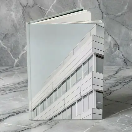 White Modern Building Corner Against Gray Sky