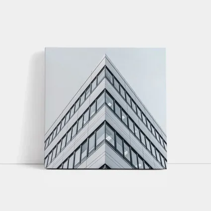 Modern Office Building Corner Against Gray Sky