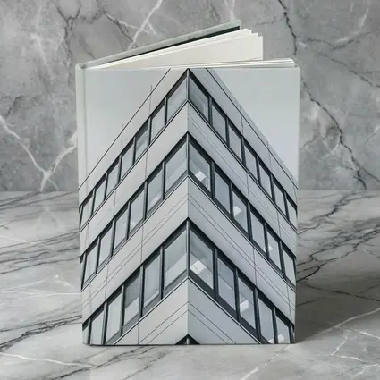 Modern Office Building Corner Against Gray Sky