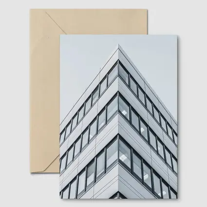 Modern Office Building Corner Against Gray Sky