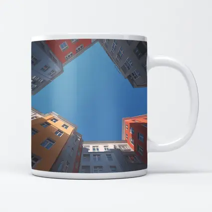 Looking Up Between Colorful City Buildings Sky
