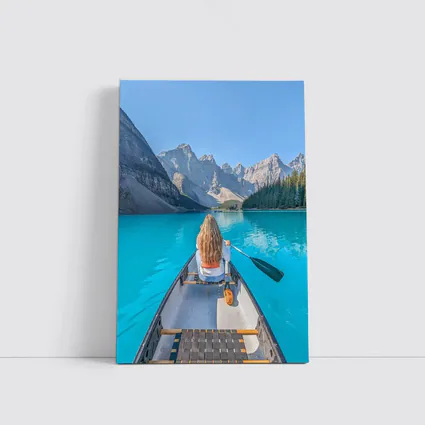 Woman Canoeing Turquoise Mountain Lake Canada