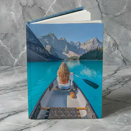 Woman Canoeing Turquoise Mountain Lake Canada