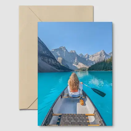 Woman Canoeing Turquoise Mountain Lake Canada