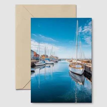 Sailboats Moored in Calm Blue Harbor