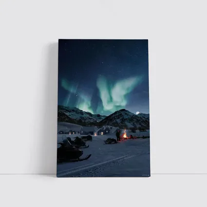 Northern Lights Over Snowy Mountain Village