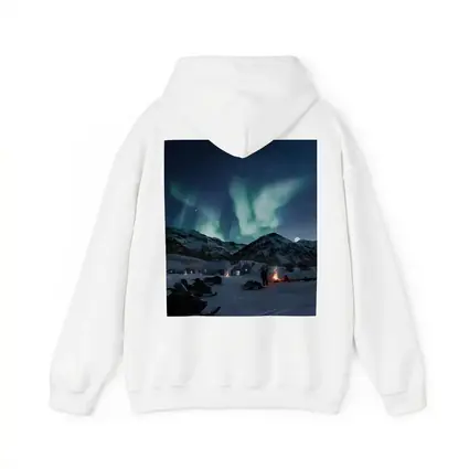 Northern Lights Over Snowy Mountain Village