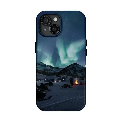 Northern Lights Over Snowy Mountain Village