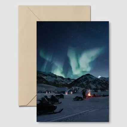 Northern Lights Over Snowy Mountain Village