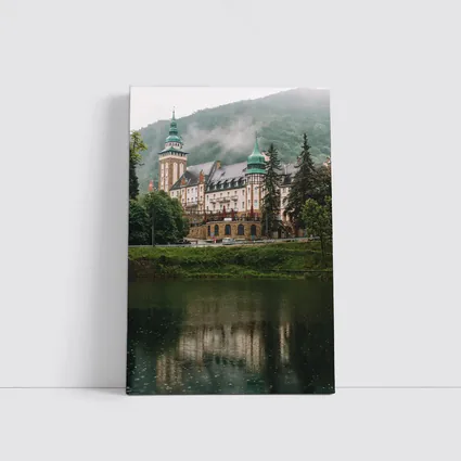 Historic Castle Reflecting On Misty Lake
