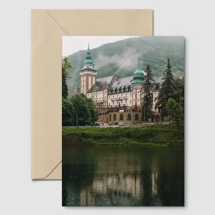 Historic Castle Reflecting On Misty Lake