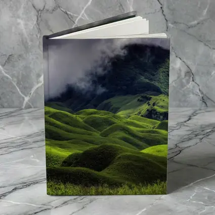 Green Rolling Hills Storm Clouds Mountains