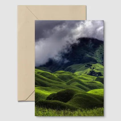 Green Rolling Hills Storm Clouds Mountains