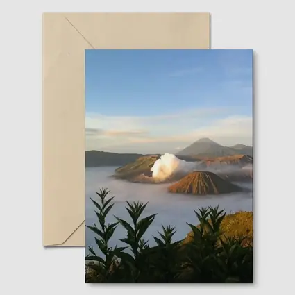 Mount Bromo Volcano Erupting Above Clouds Indonesia