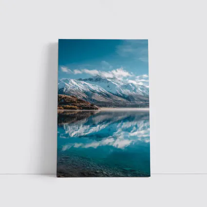 Snow Capped Mountains Reflected In Blue Lake