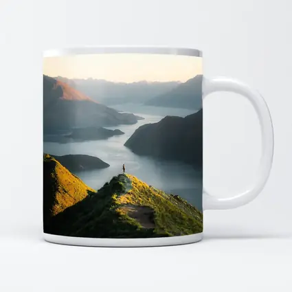 Lone Hiker Overlooking Mountain Lake Landscape