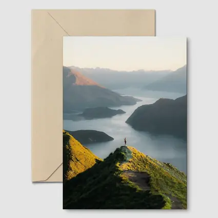 Lone Hiker Overlooking Mountain Lake Landscape