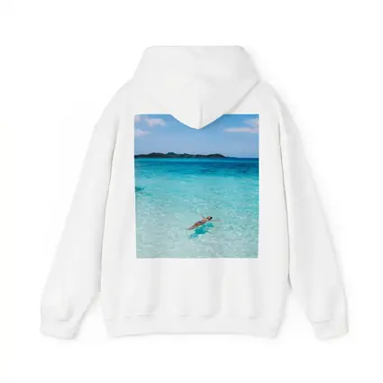Woman Floating In Turquoise Tropical Ocean