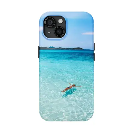 Woman Floating In Turquoise Tropical Ocean