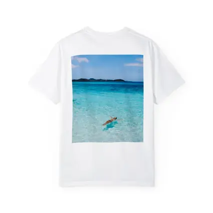 Woman Floating In Turquoise Tropical Ocean