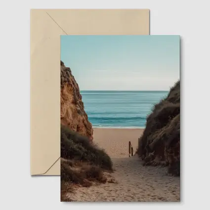 Sandy Beach Path Between Rocky Cliffs