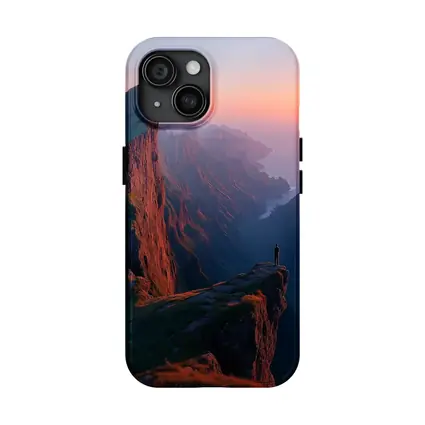 Lone Figure Standing Cliff Edge Sunset Mountains