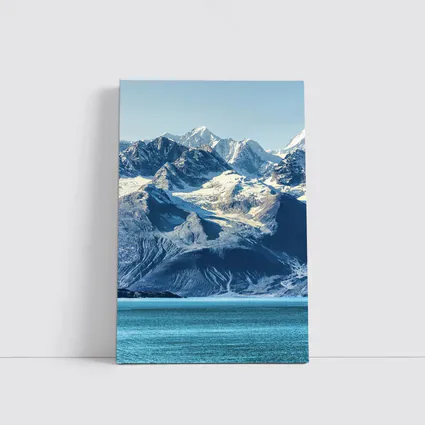 Snow Capped Mountains Over Turquoise Glacial Lake