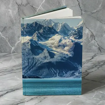 Snow Capped Mountains Over Turquoise Glacial Lake